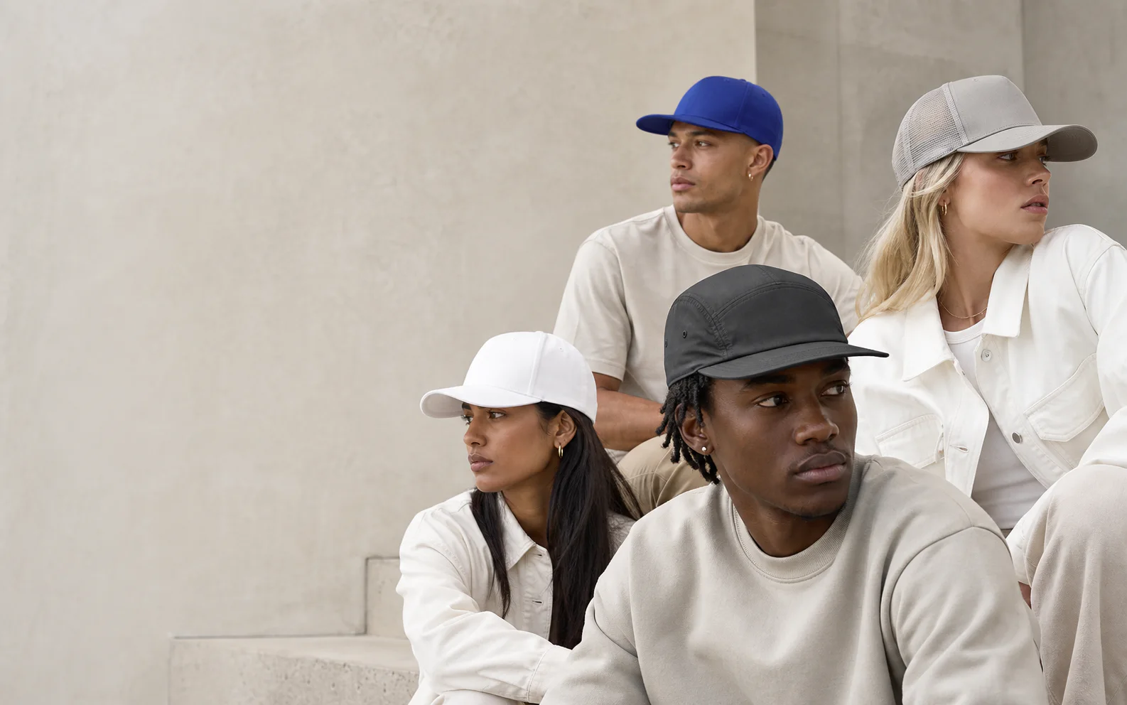 Diverse friends wearing clean unbranded caps